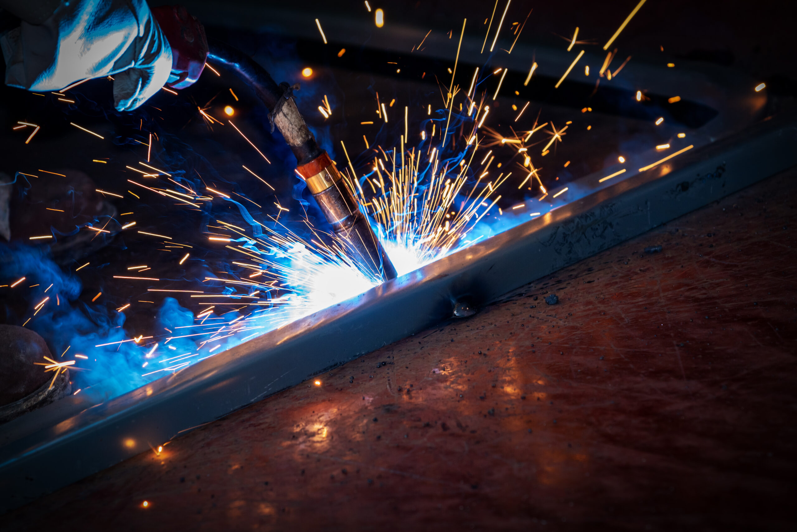 The welder is welding steel plates
